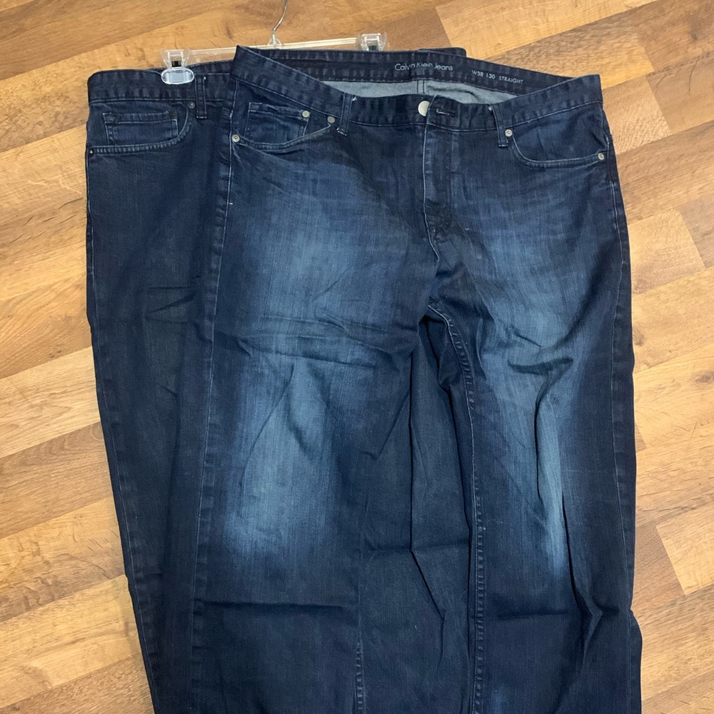 Two pairs of Men’s dark Calvin Klein jeans